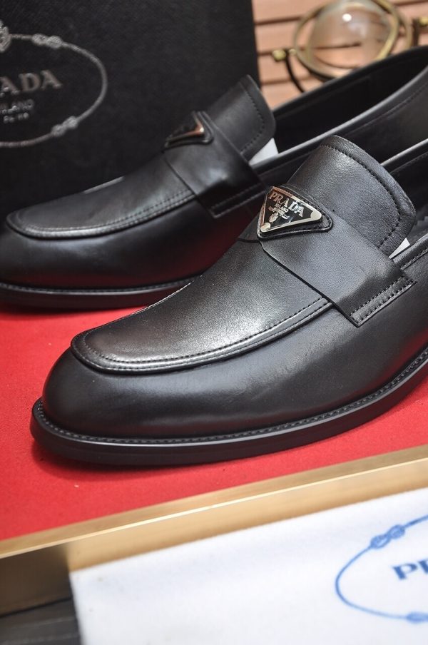 Prada Chocolate brushed leather loafers.