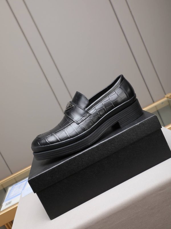 Prada black brushed leather loafers.