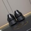 Prada black brushed leather loafers.