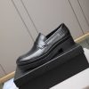 black Prada brushed leather loafers.