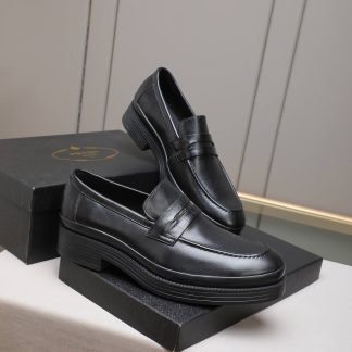 black Prada brushed leather loafers.