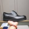 Prada black leather lace-up derby shoes.
