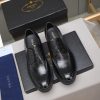 Prada black leather lace-up derby shoes.