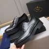 Prada black leather lace-up derby shoes.