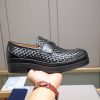 Prada woven leather loafers.