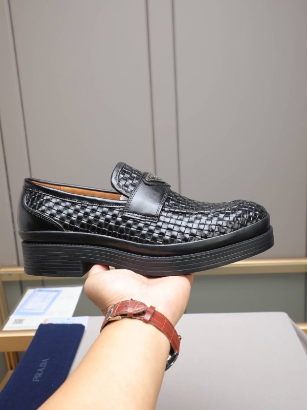 Prada woven leather loafers.