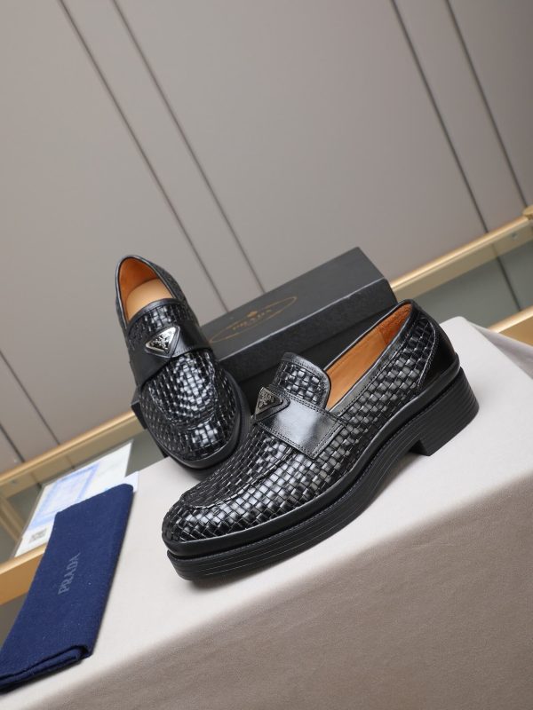 Prada woven leather loafers.