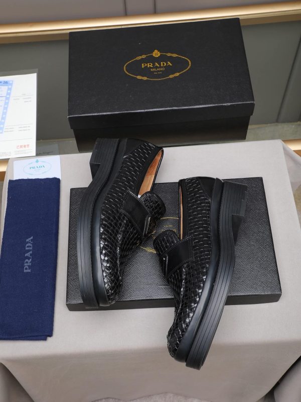 Prada woven leather loafers.