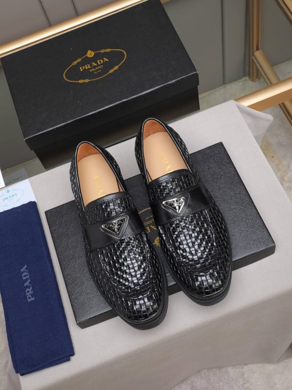 Prada woven leather loafers.