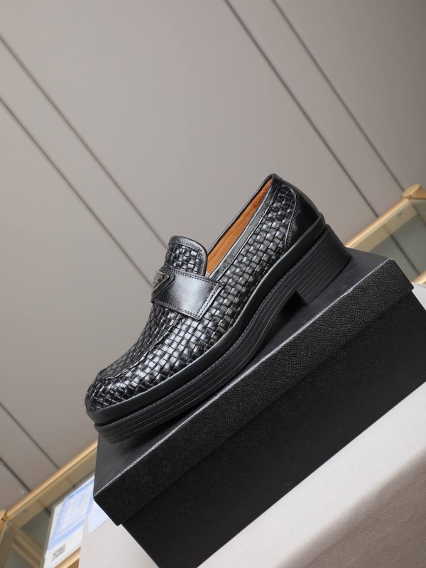 Prada woven leather loafers.