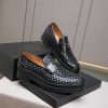Prada woven leather loafers.