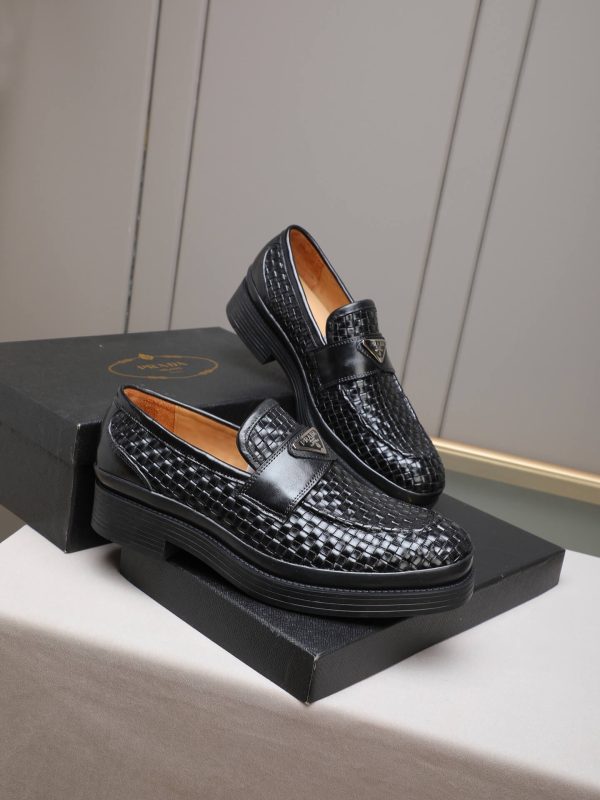 Prada woven leather loafers.