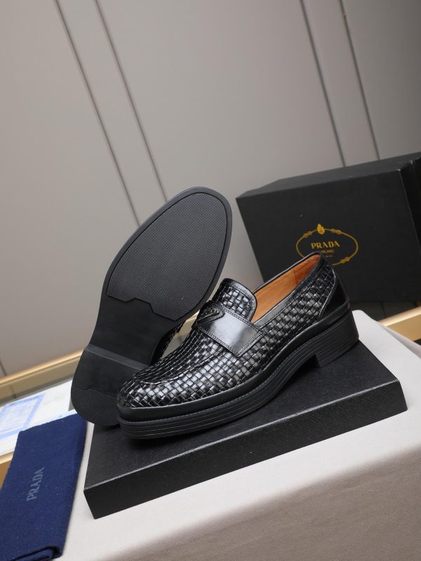 Prada woven leather loafers.