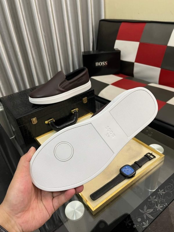 BOSS brown leather slip-on sneakers.