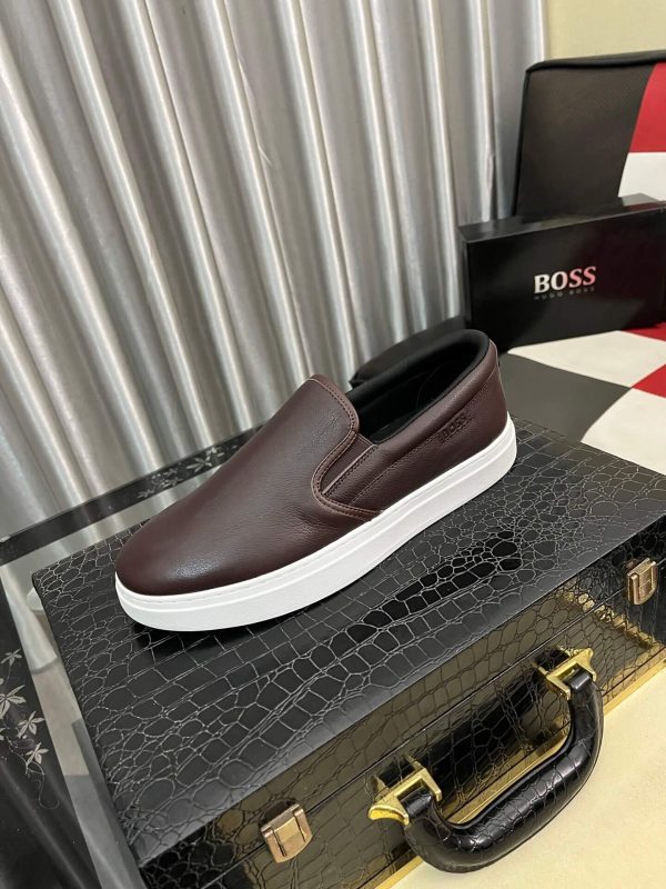 BOSS brown leather slip-on sneakers.