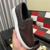 BOSS brown leather slip-on sneakers.