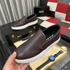 BOSS brown leather slip-on sneakers.