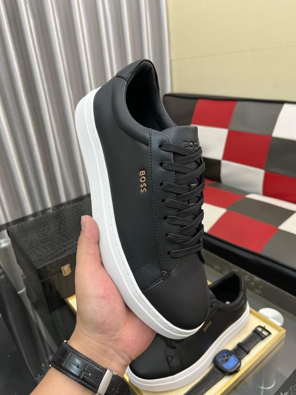 BOSS brown leather slip-on sneakers.