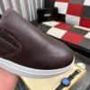 BOSS brown leather slip-on sneakers.
