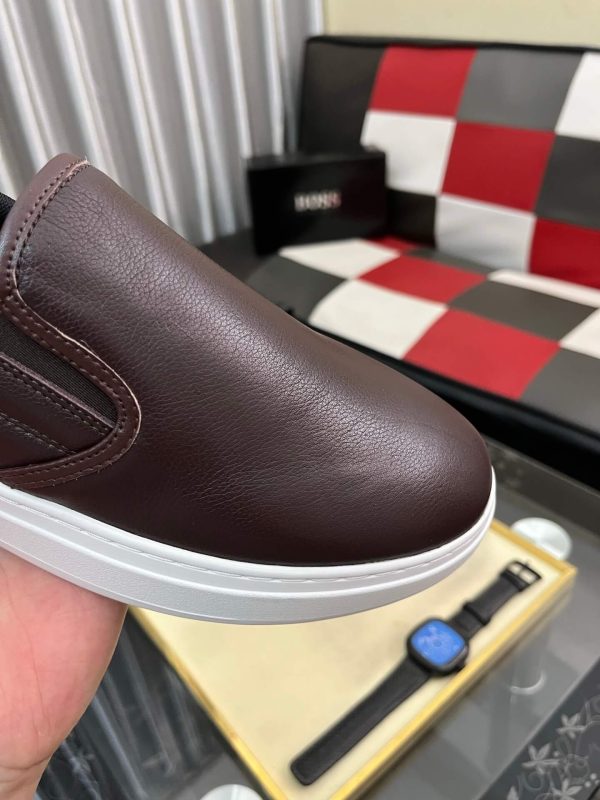 BOSS brown leather slip-on sneakers.