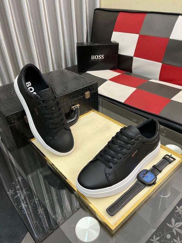 BOSS brown leather slip-on sneakers.