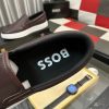 BOSS brown leather slip-on sneakers.