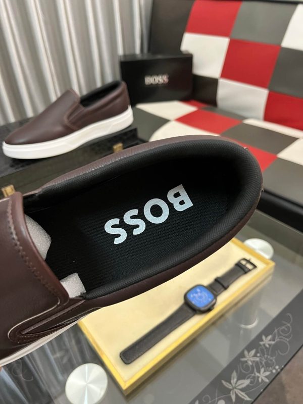 BOSS brown leather slip-on sneakers.