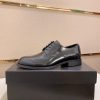 black Prada leather derby dress shoes.