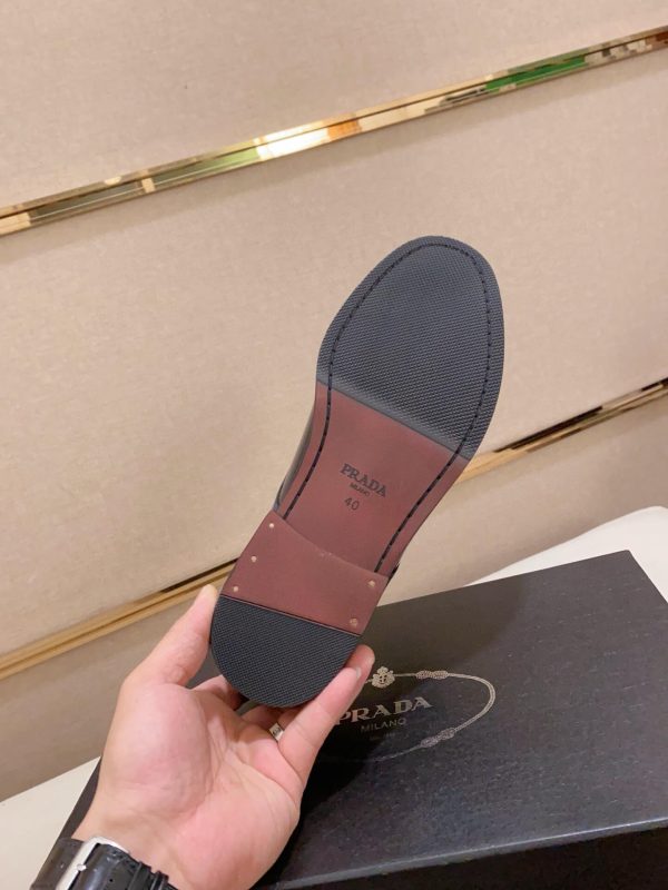 black Prada leather derby dress shoes.