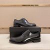 black Prada leather derby dress shoes.
