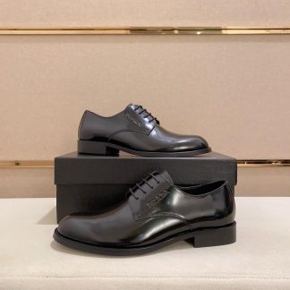 black Prada leather derby dress shoes.