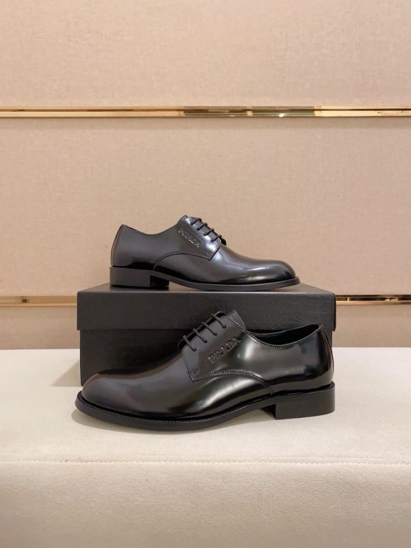 black Prada leather derby dress shoes.