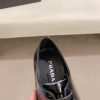 black Prada leather derby dress shoes.