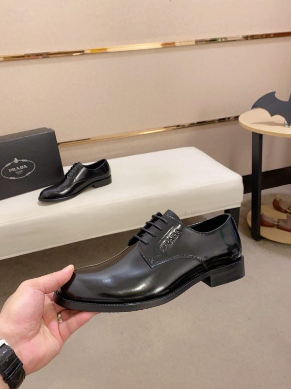 black Prada leather derby dress shoes.