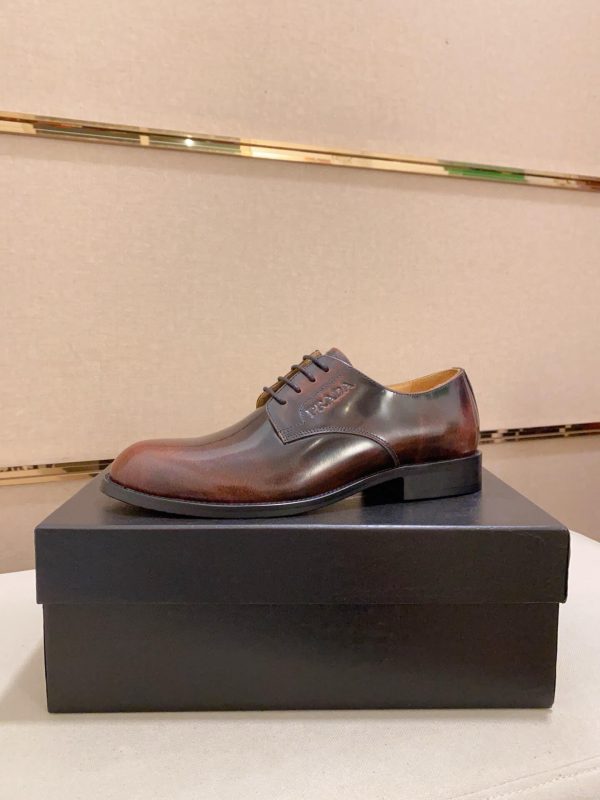 Brown men's formal derby shoes.