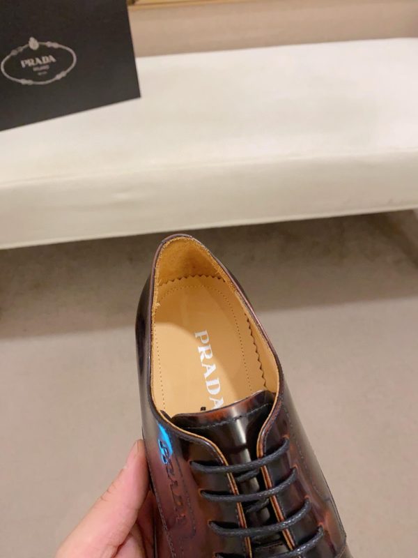 Brown men's formal derby shoes.