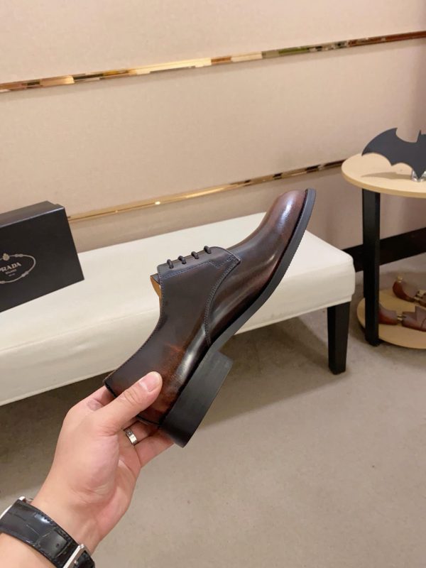 Brown men's formal derby shoes.