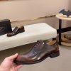 Brown men's formal derby shoes.
