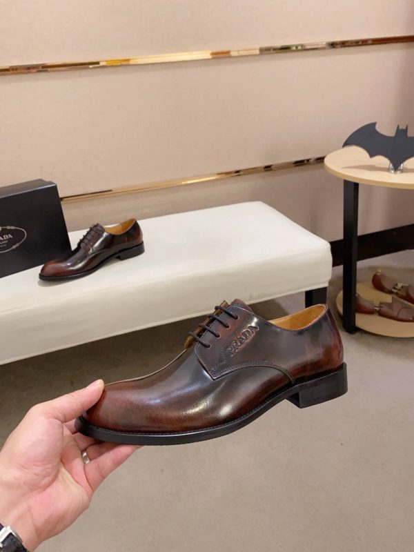 Brown men's formal derby shoes.