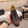 Brown men's formal derby shoes.