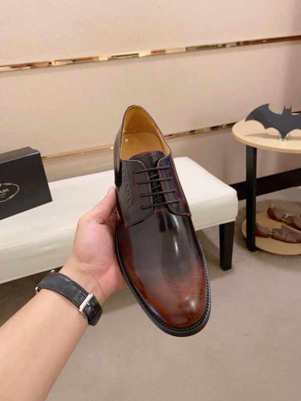 Brown men's formal derby shoes.