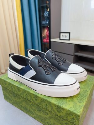 Gucci Slip-On sneakers in black and white.