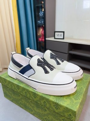 Gucci Slip-On sneakers in black and white.