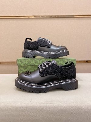 Gucci black leather canvas derby shoes.