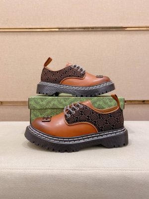 Gucci leather canvas platform derby shoes.