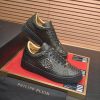 Philipp Plein black real python leather lo-top sneakers.