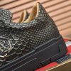 Philipp Plein black real python leather lo-top sneakers.