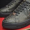 Philipp Plein black real python leather lo-top sneakers.