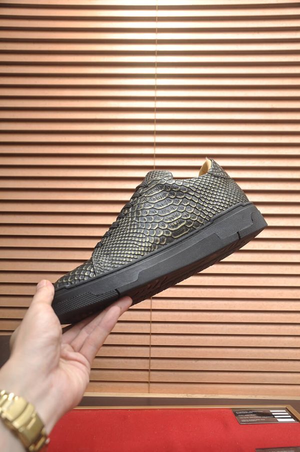 Philipp Plein black real python leather lo-top sneakers.