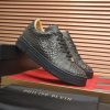 Philipp Plein black real python leather lo-top sneakers.